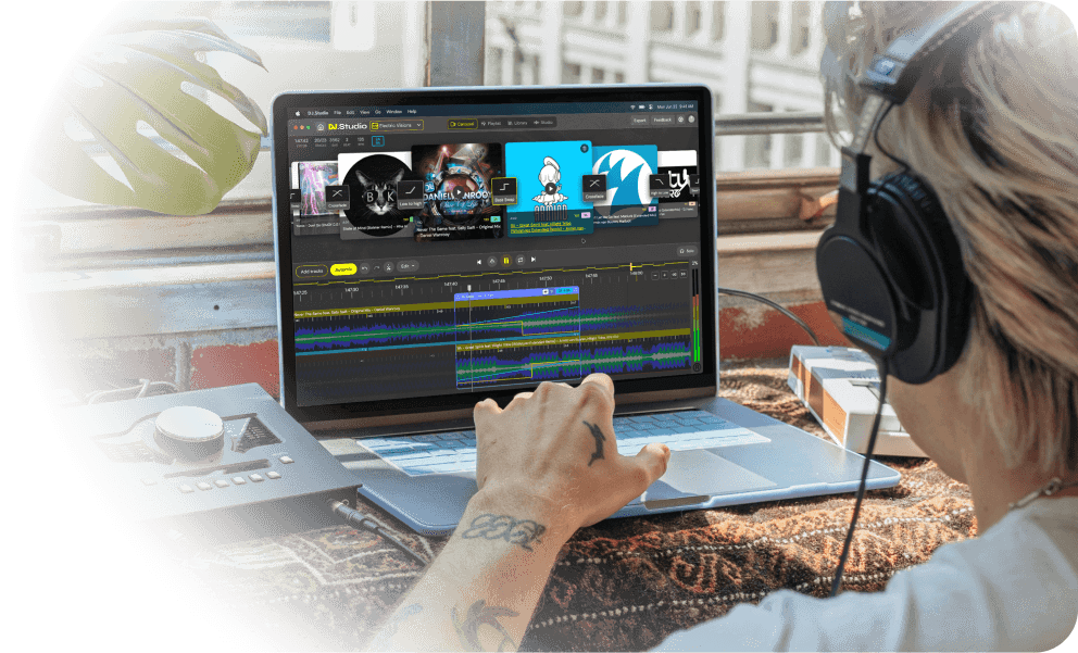 DJ working on his laptop with the DJ.Studio carousel tab open